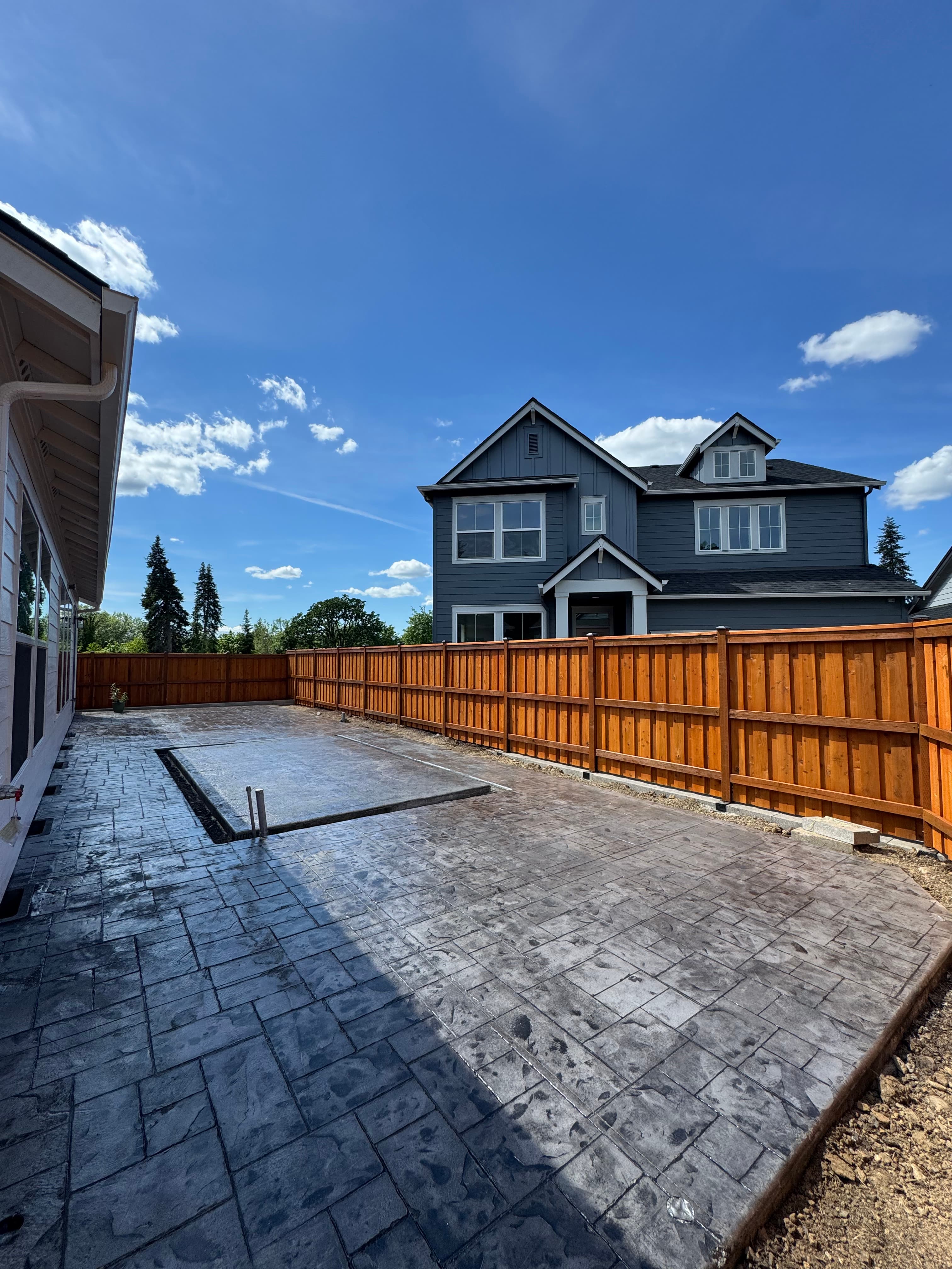 Cedar fence and stamped concrete patio Vancouver WA
