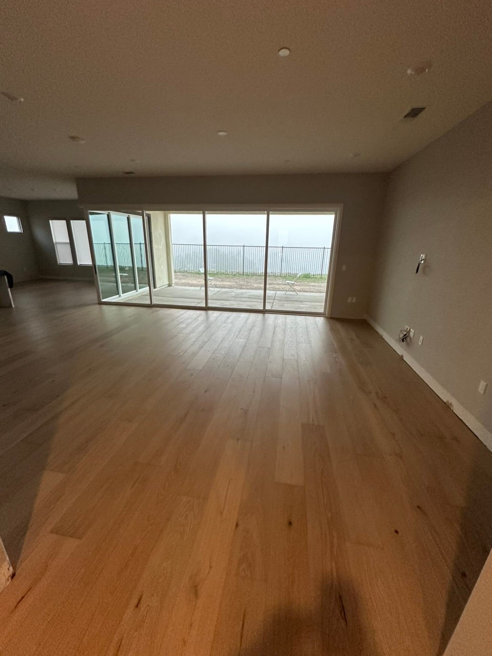 Wide plank hardwood flooring installation open living room Vancouver WA