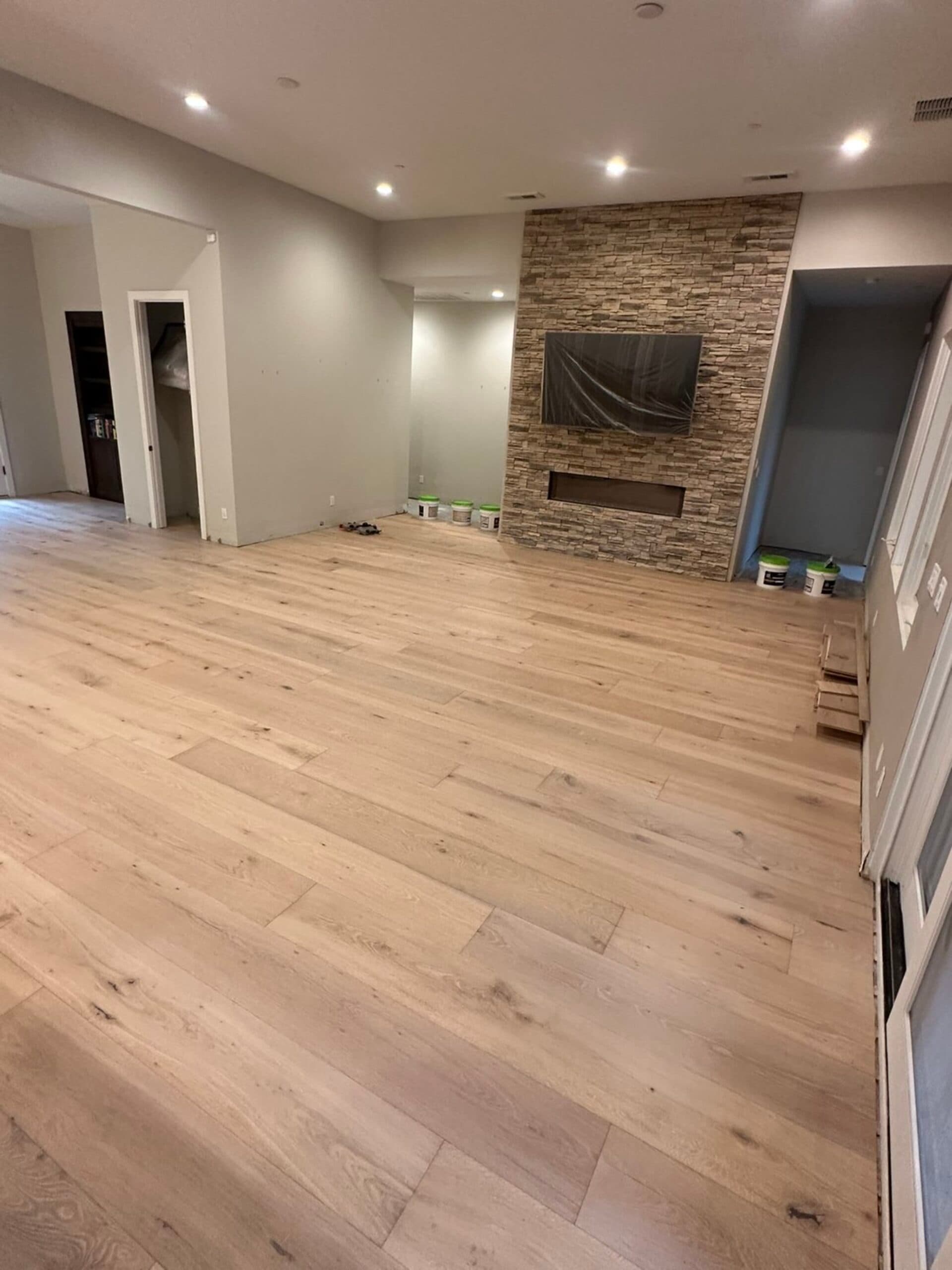 Hardwood flooring living room with stone fireplace Clark County WA